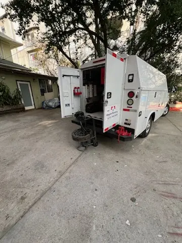 Magnet Plumbing service vehicle on-site for Grease Trap Cleaning in Lacona